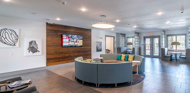 Interior lobby with seating and tv