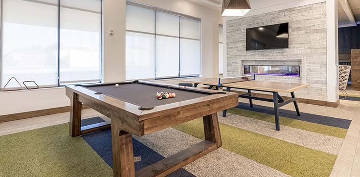 The Standard at Auburn clubhouse featuring a pool table