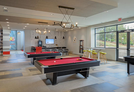 Interior lounge with pool tables and tvs