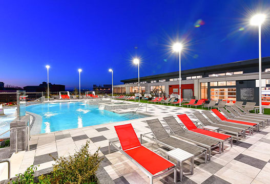 Resort style pool surrounded by lounge chairs