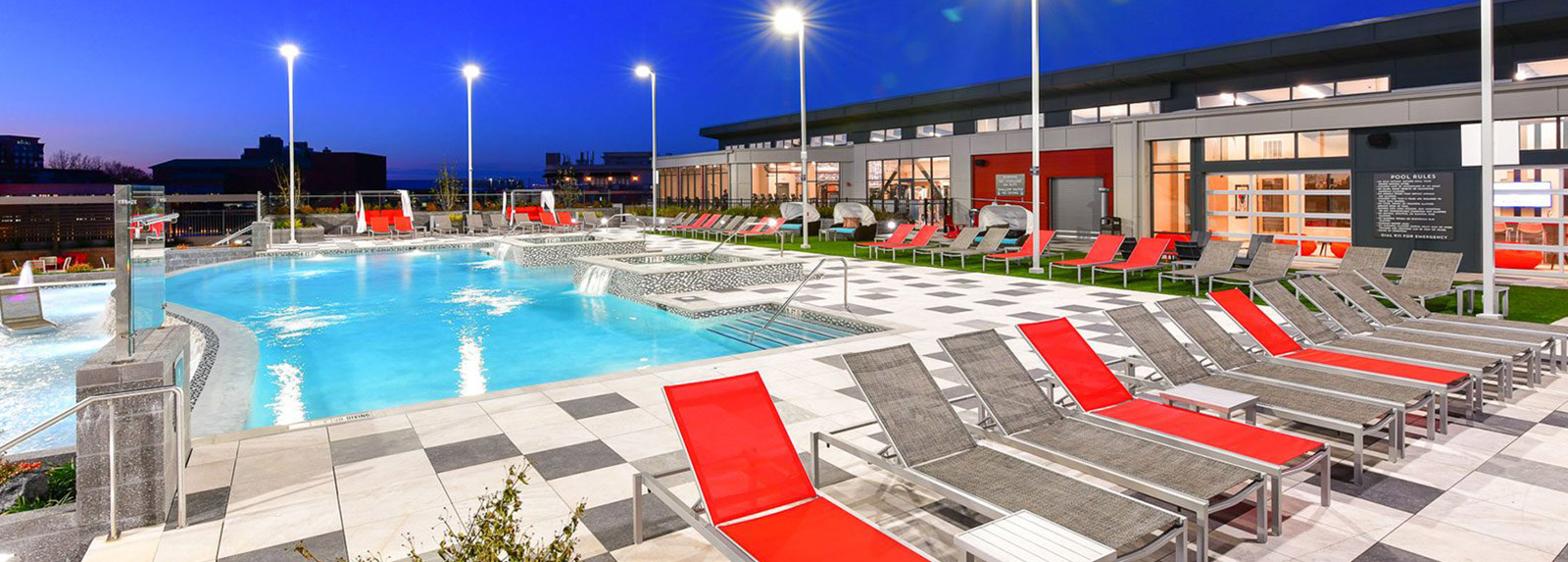 Resort style pool surrounded by lounge chairs