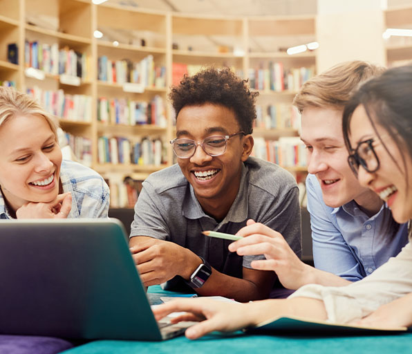 Group of young adult studying on laptop
