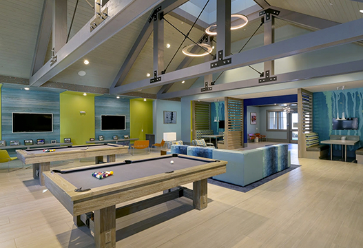 Interior lounge with pool tables and tvs