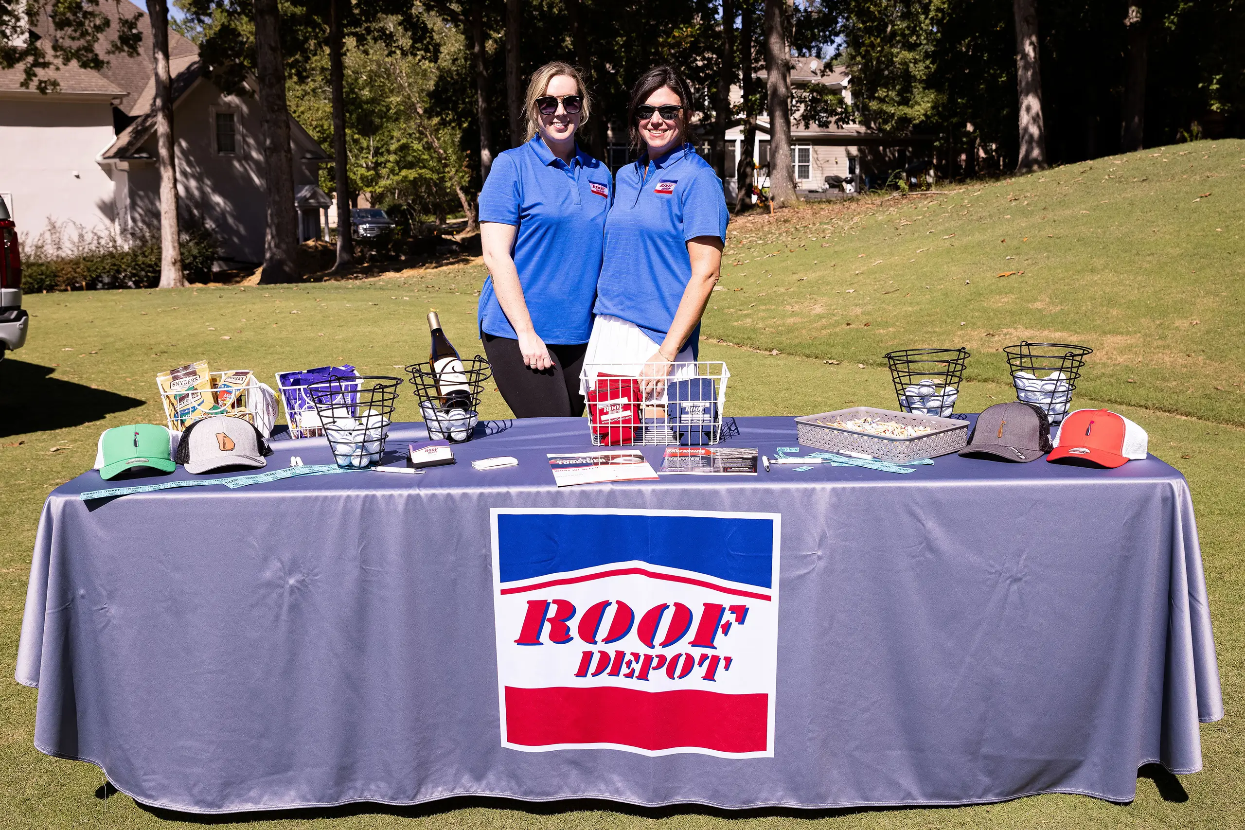 two women at a Roof Depot booth
