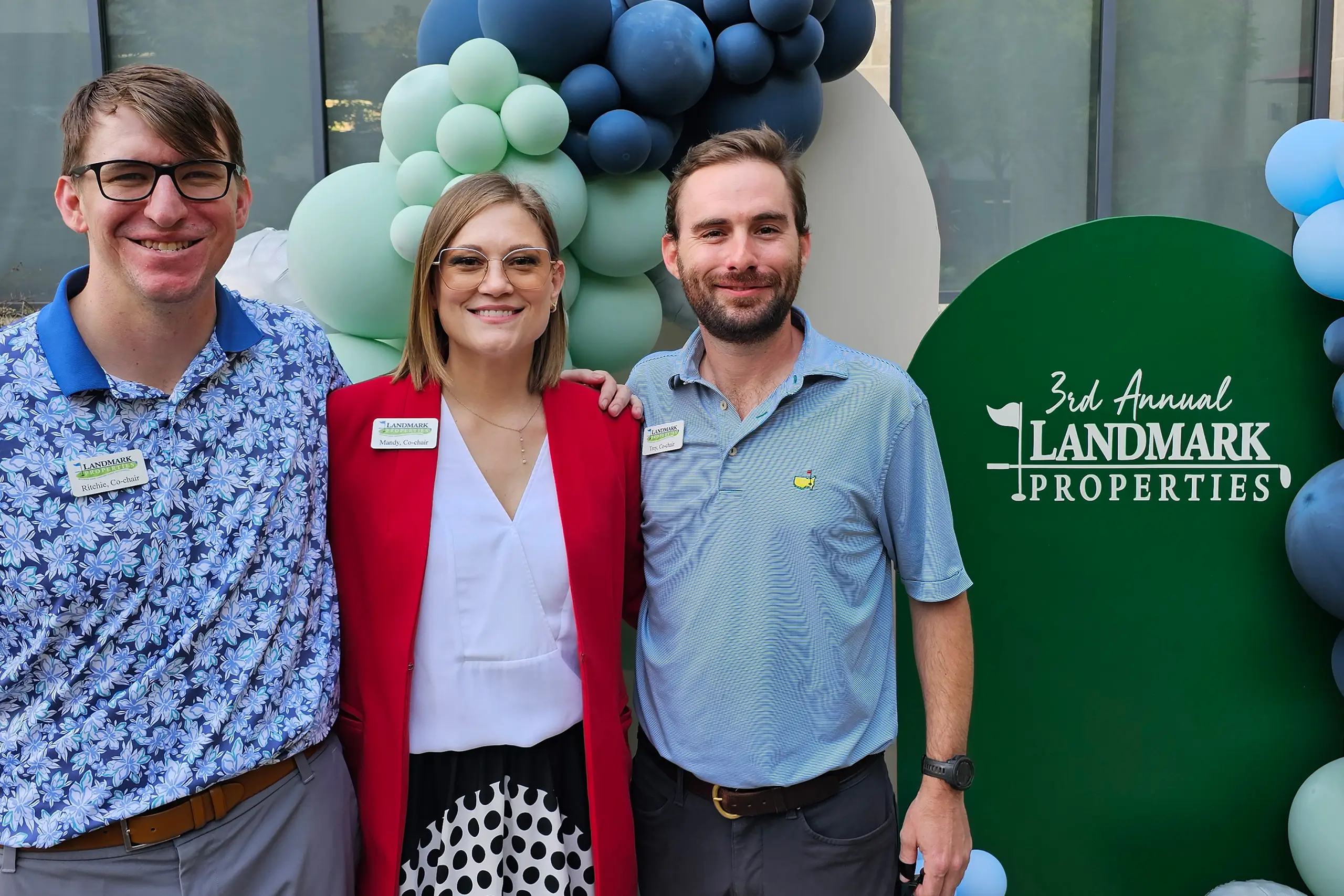 a group of people at the 3rd Annual Landmark Properties golf tournament