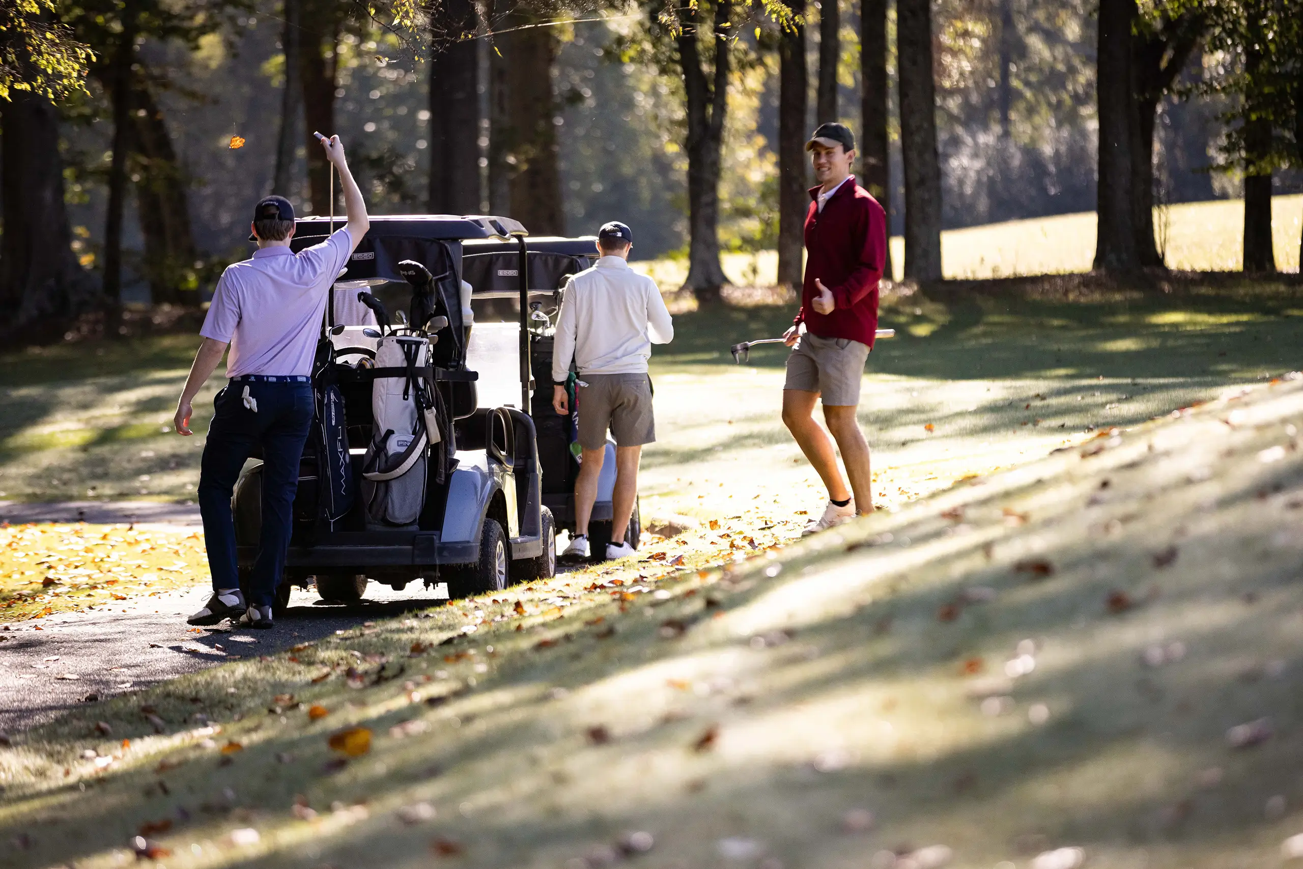 a group of men playing golf